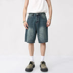 Washed blue React Jorts by 2KWRLD featuring distressed denim and a relaxed fit, casual shorts for streetwear style.