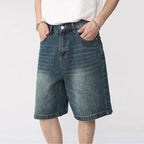 Washed denim React Jorts by 2KWRLD featuring distressed edges and a relaxed fit, casual summer denim shorts above the knee.