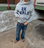 Light gray 2KWRLD College Hoodie with front pocket and drawstrings, featuring the 2KWRLD logo on the chest.