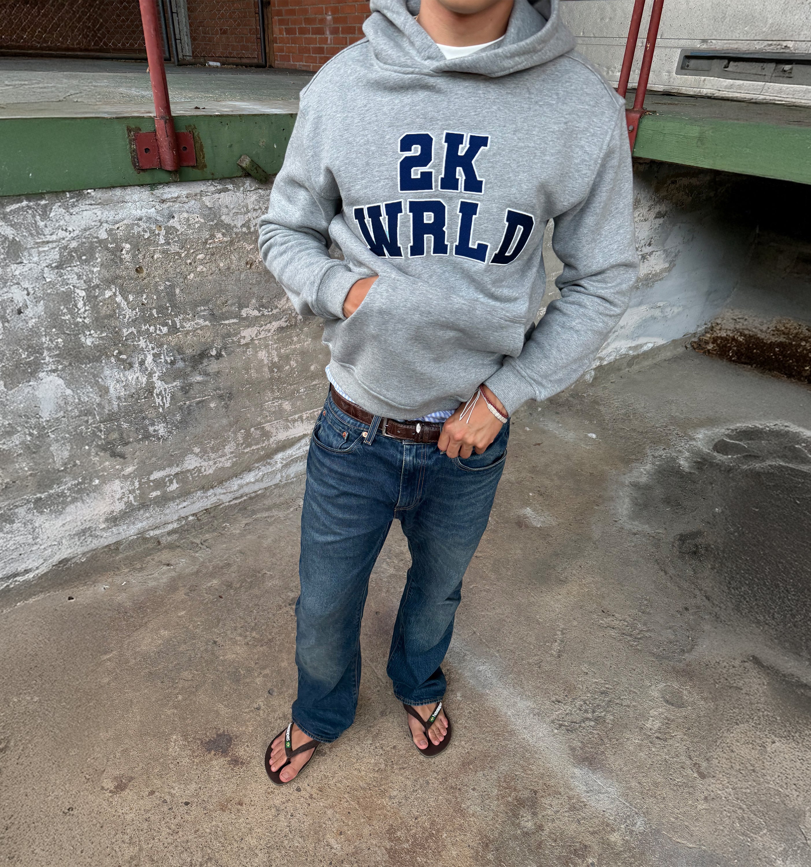 XS 2KWRLD College Hoodie featuring a casual fit with the 2KWRLD logo on the front and soft fabric for comfort.