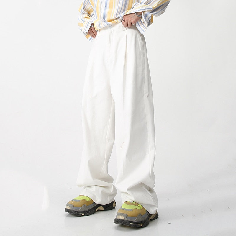 Black loose suit pants from 2KWRLD, featuring a relaxed fit and stylish design, perfect for casual or formal wear.